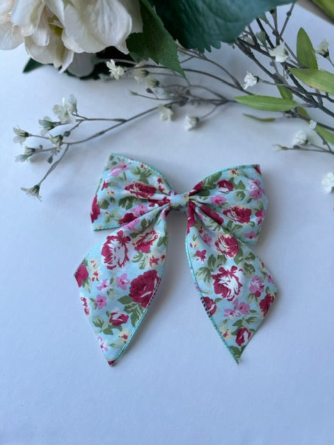Dusty blue/pink floral print tail clip in hair bow