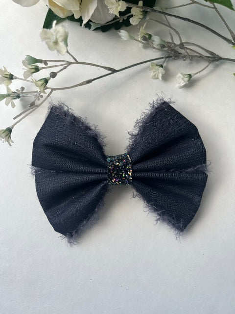Dark blue jean with edge fringe double pinch center clip in hair bow
