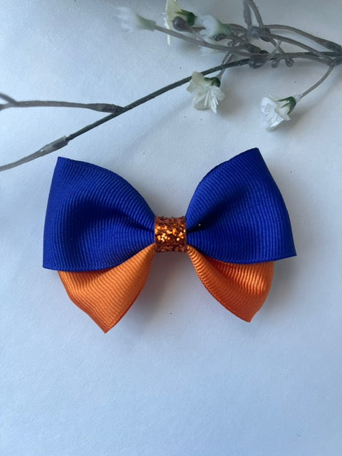 Blue and orange butterfly pinch clip in hair bow